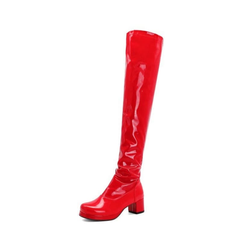 Bright red patent leather knee-high boot with a chunky heel.