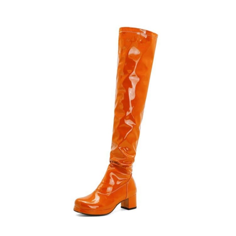 Bright orange patent leather knee-high boot with a chunky heel.