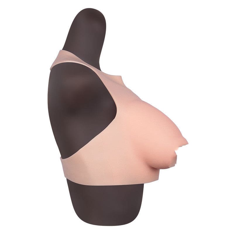 Partial torso mannequin displaying a female breast form.