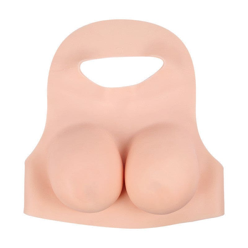 A flesh-colored silicone prosthetic chest piece with exaggerated feminine features.