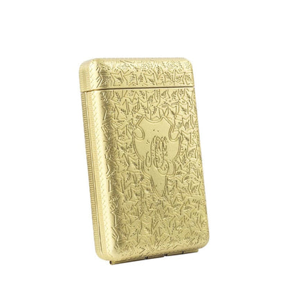 Ornate gold-colored cigarette case with intricate engraved floral patterns.