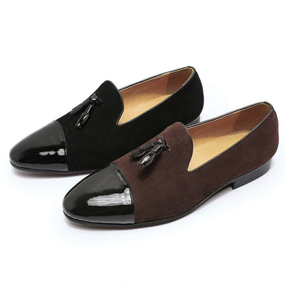 Pair of men’s dress loafers with patent leather toe caps and tassels.