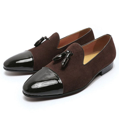 Pair of brown loafers with patent leather toe caps and tassels.