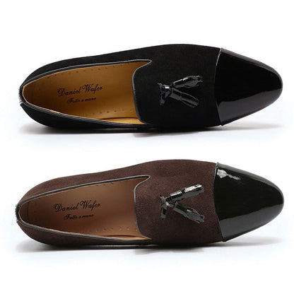 Two pairs of men’s dress loafers with tassel details.