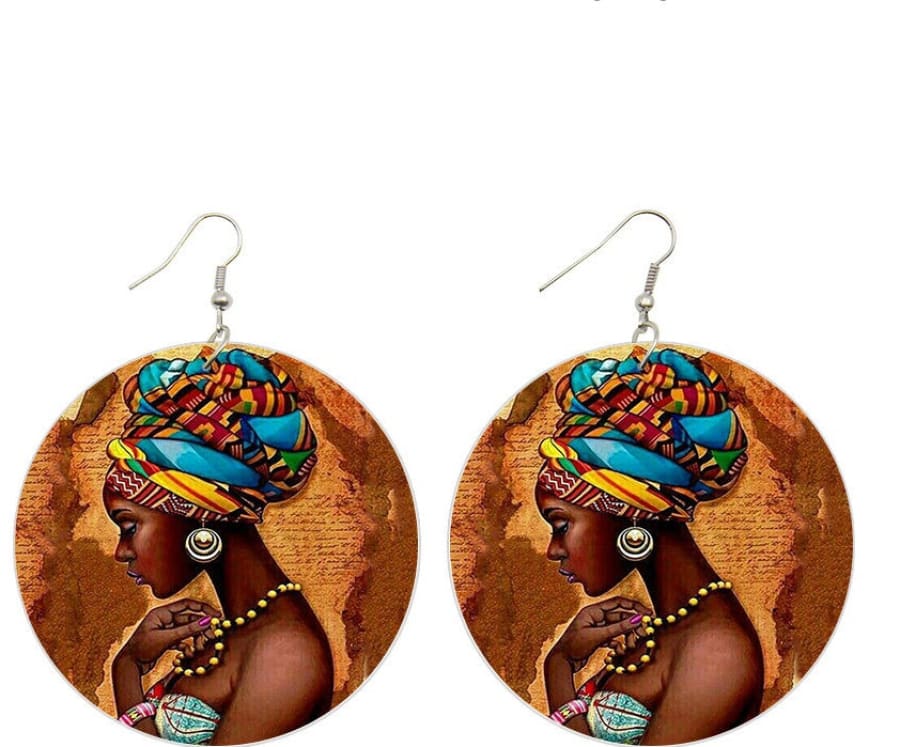 Pair of circular earrings featuring a colorful portrait of an African woman with a vibrant headwrap.