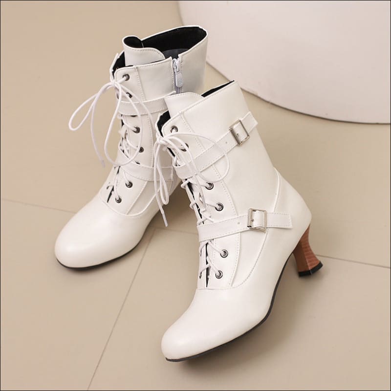 White lace-up mid heel ankle boots with buckle straps, perfect for Steampunk style.