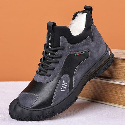 Gray and black athletic sneaker with a rugged sole and lace-up design.