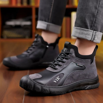 Black leather sneakers with a rugged sole and lace-up design.