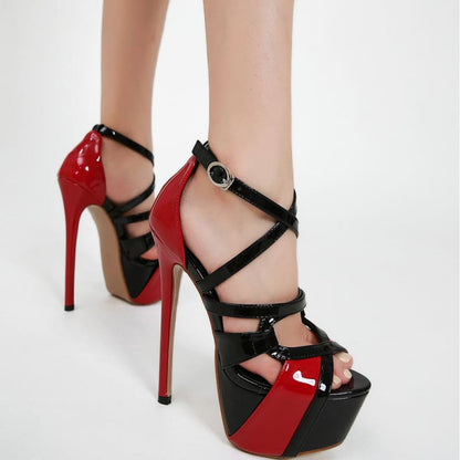 Pair of red and black high-heeled platform sandals with strappy design.