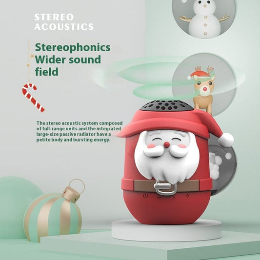 Santa Claus-shaped red and white Bluetooth speaker with a smiling face.