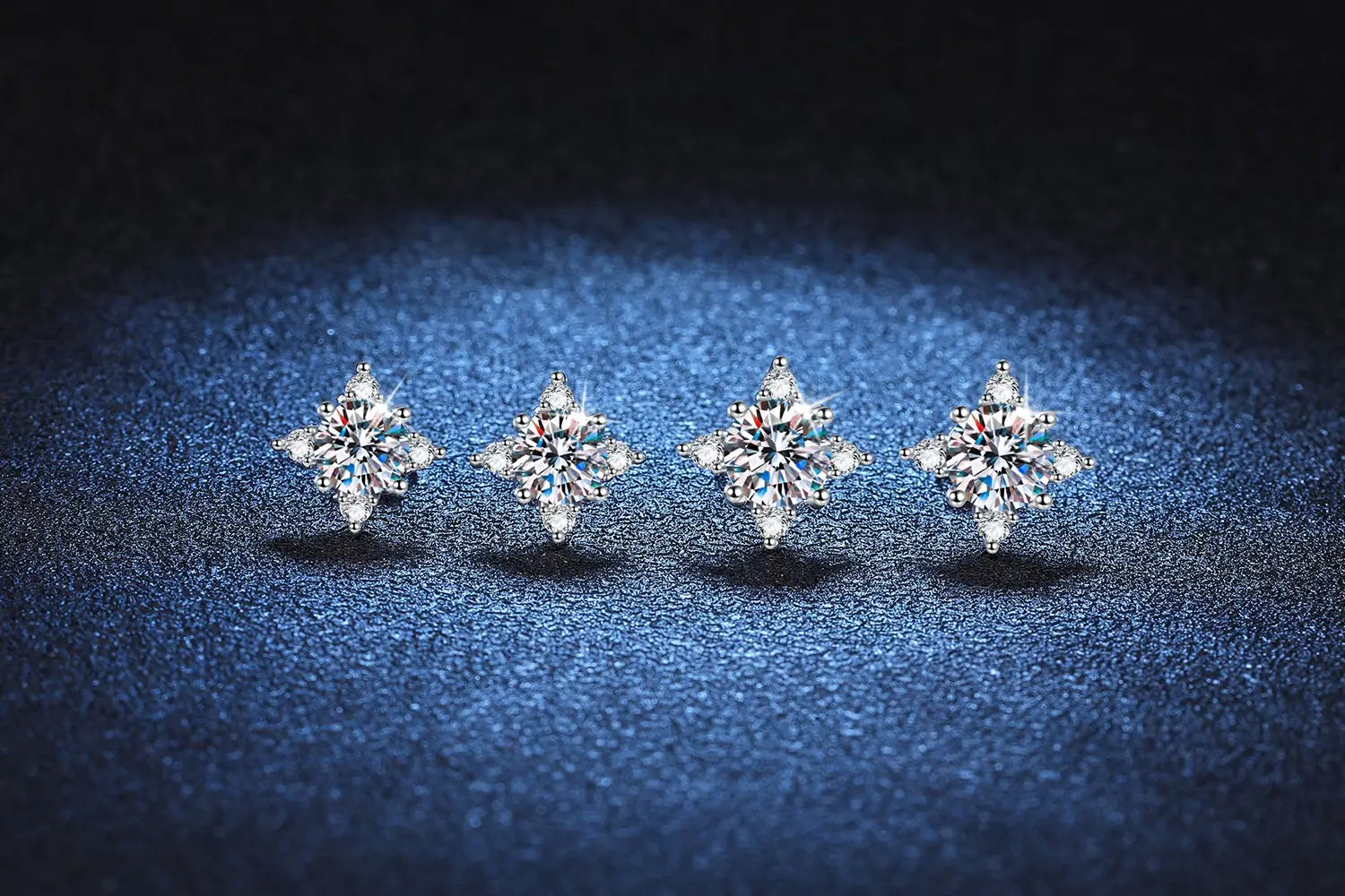 Sparkling Snowflake Moissanite Diamond Four-Claw Stud Earrings in Sterling Silver.