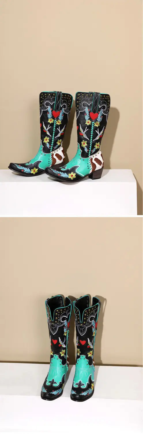 Turquoise and black women’s western boots with exquisite embroidery and floral designs.