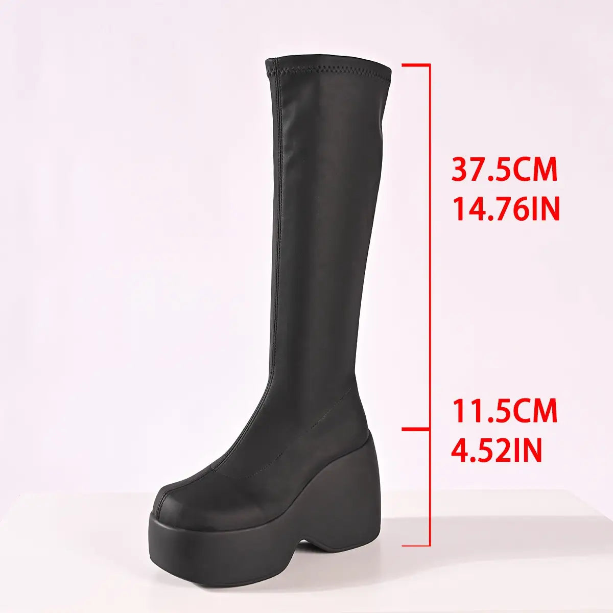 Black chunky platform elasticated knee-length boots with red measurement details.