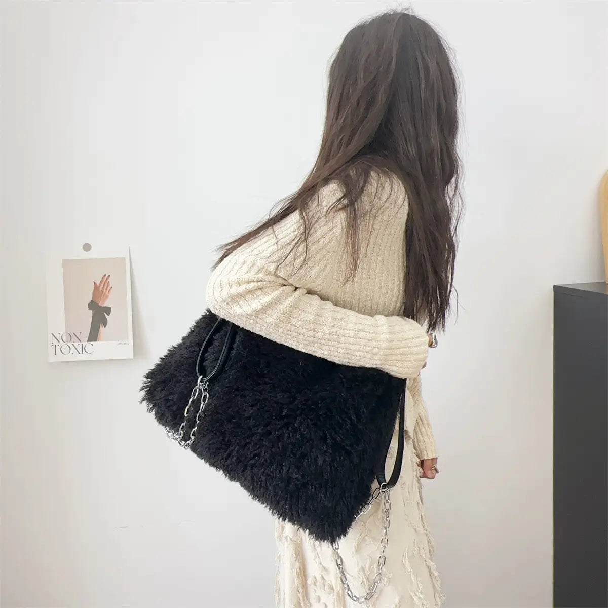 Black fluffy plush large capacity shoulder bag with a stylish strap for everyday use.