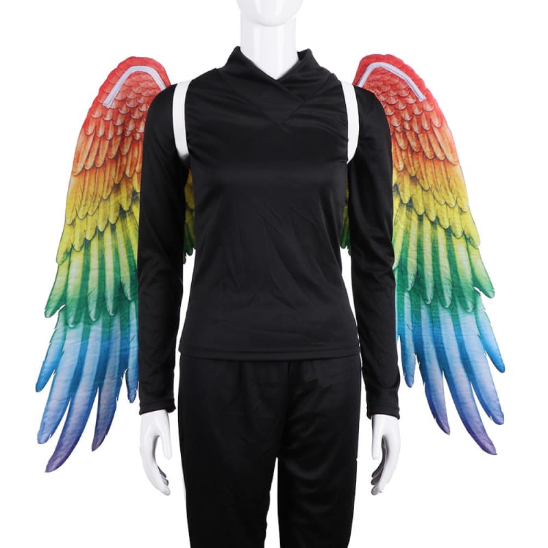 Mannequin wearing a black outfit with colorful rainbow wings attached.