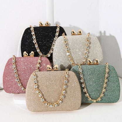 Glittery evening clutch purses with gold chain straps in various pastel colors.