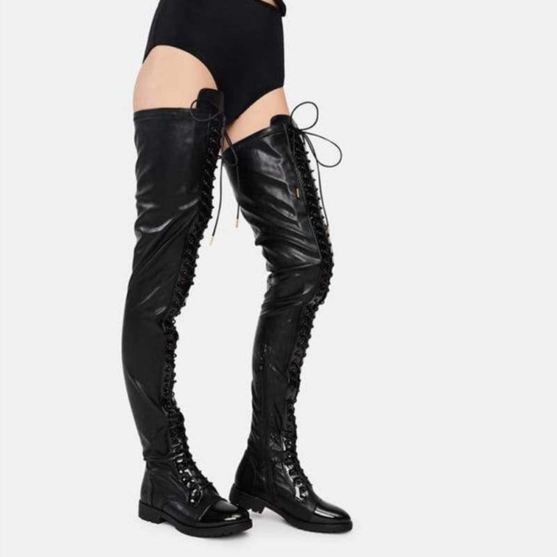 Pair of black leather thigh-high lace-up boots.