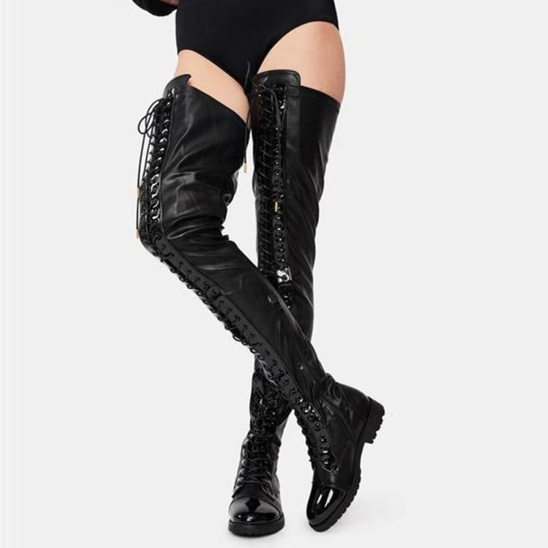 Pair of black leather thigh-high lace-up boots.