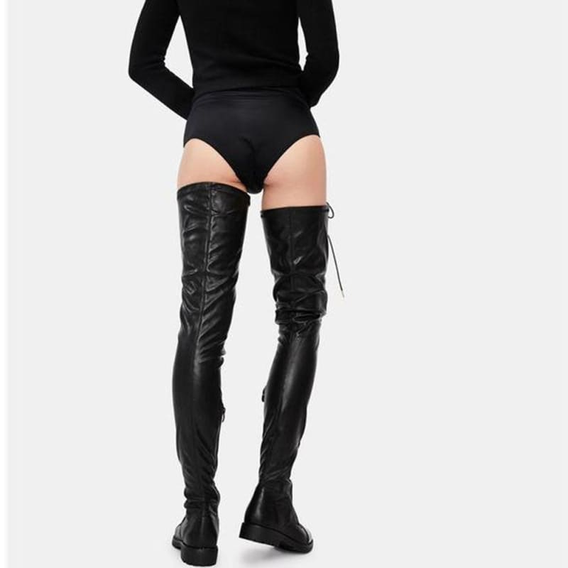 Pair of black leather thigh-high boots with lace-up backs.