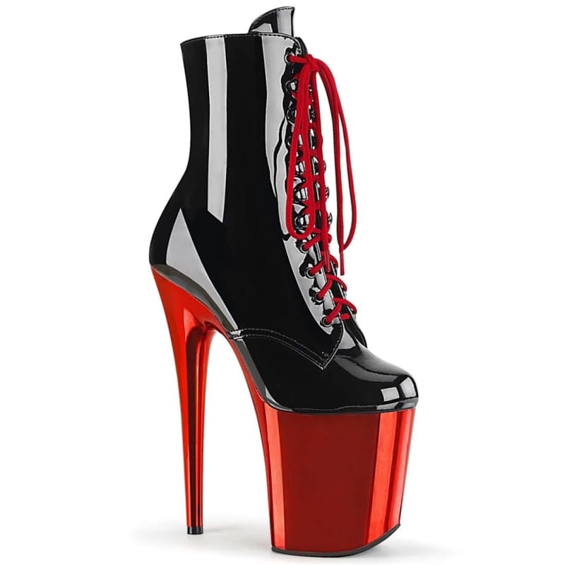 Extremely high platform ankle boot with a black upper, red laces, and metallic red stiletto heel and platform.