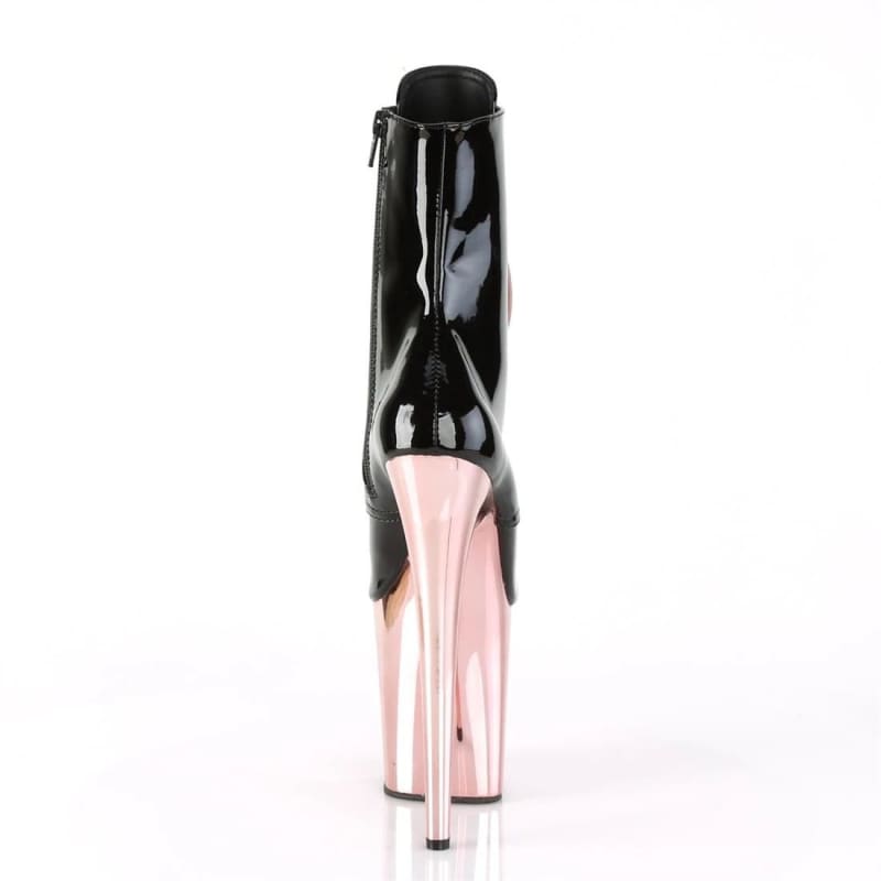 High-heeled platform ankle boot with a black upper and pink metallic heel and platform.