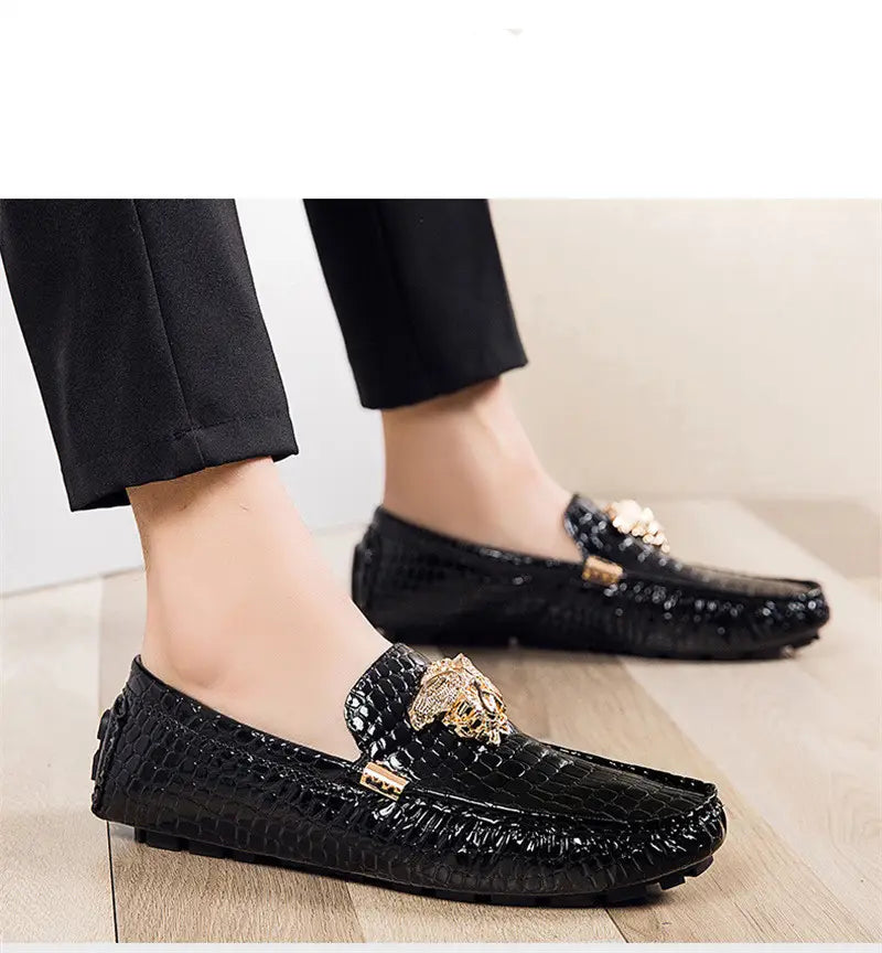 Black crocodile print loafers with gold hardware for stylish and trendy mens footwear.