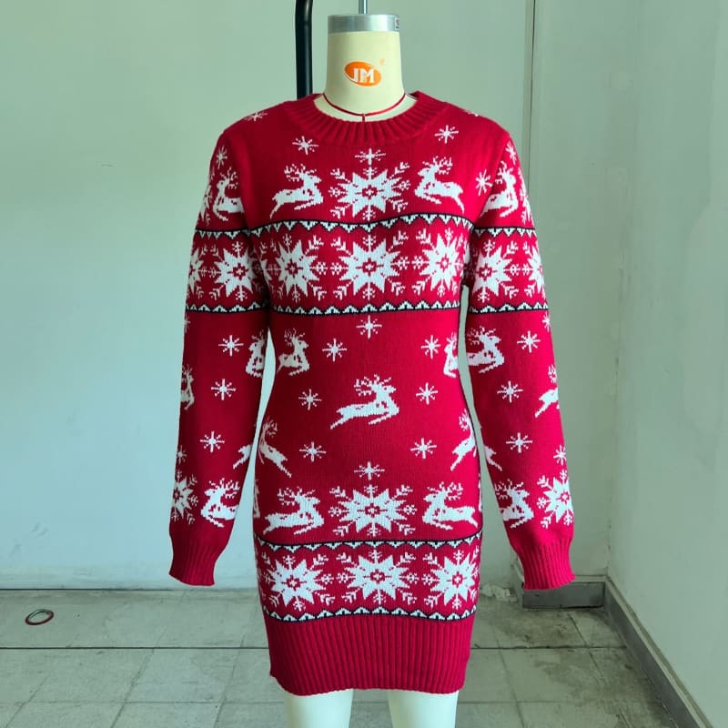 Red and white Christmas-themed knit sweater dress with reindeer and snowflake patterns.