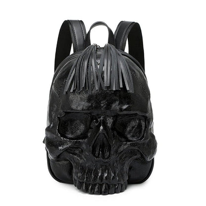 Black skull-shaped backpack with fringe detailing on top.