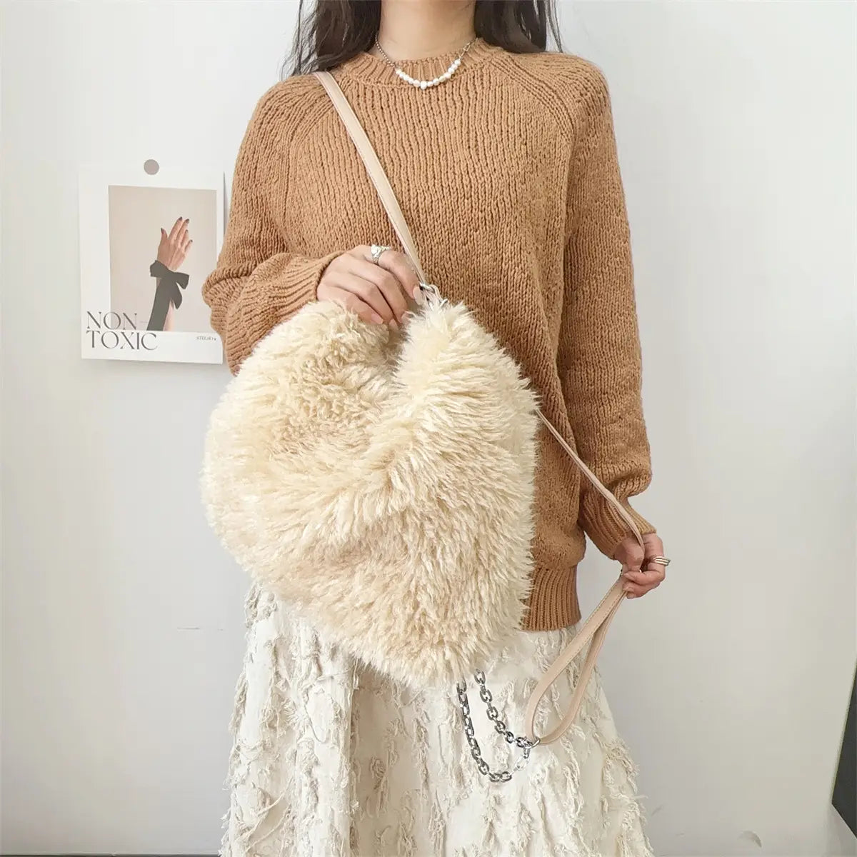 Plush large capacity cream faux fur handbag with a chic shoulder strap for style.