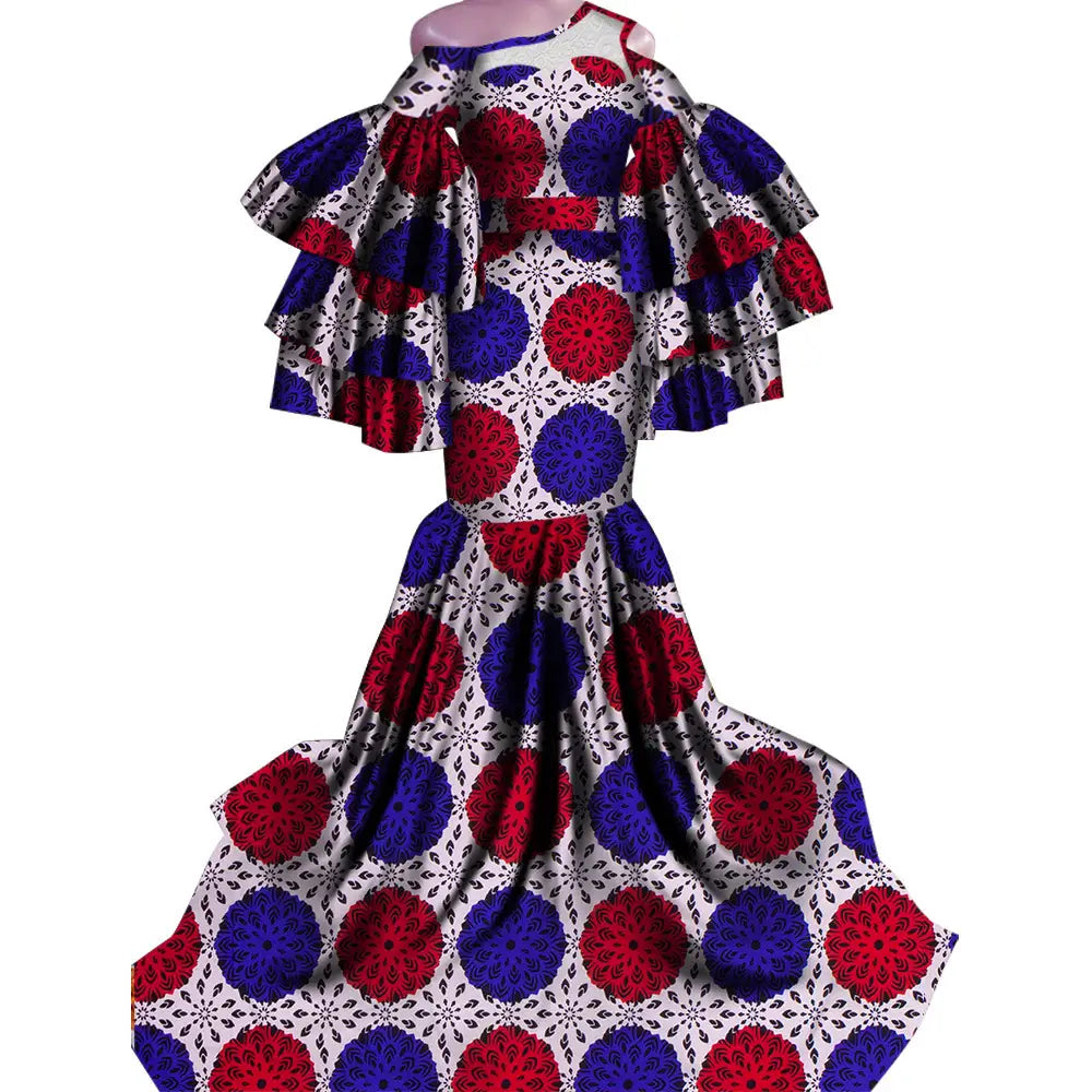 Vintage ladies African print traditional fishtail dress with ruffled sleeves in red, white, blue.