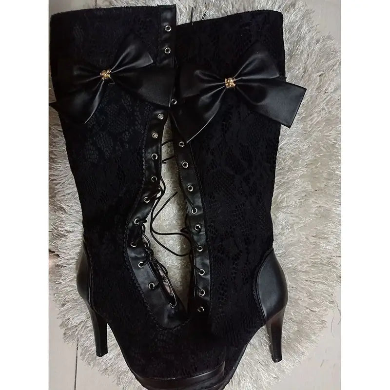 Knee High Victorian Style Boots with Bow and High Heel, featuring chic black lace-up design.