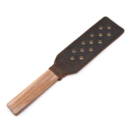 Leather paddle with wooden handle and metal studs.