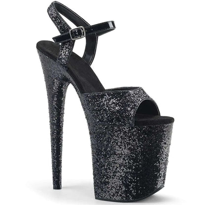 Glittery black platform high heel sandal with an ankle strap.