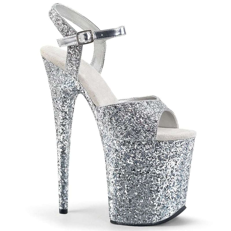 Glittery silver platform high heel sandal with an ankle strap.