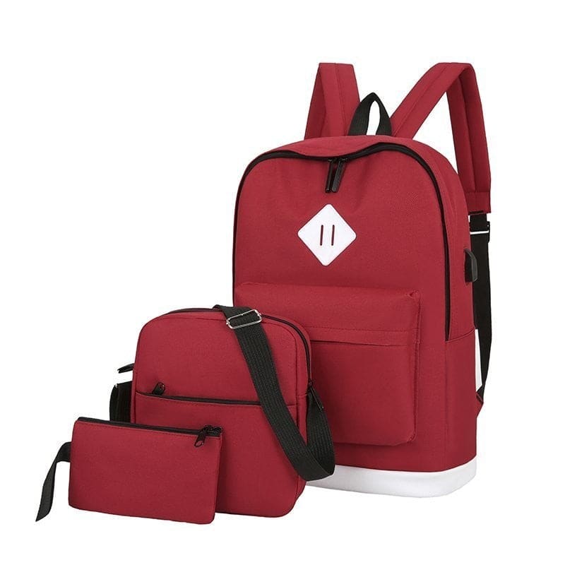 Red backpack with matching shoulder bag and accessory pouch.