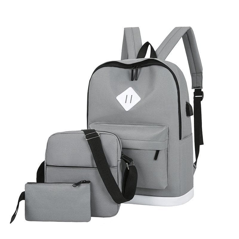 Gray backpack with matching shoulder bag and pouch.