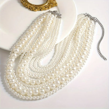 Multi-strand pearl necklace with varying sizes of pearls.