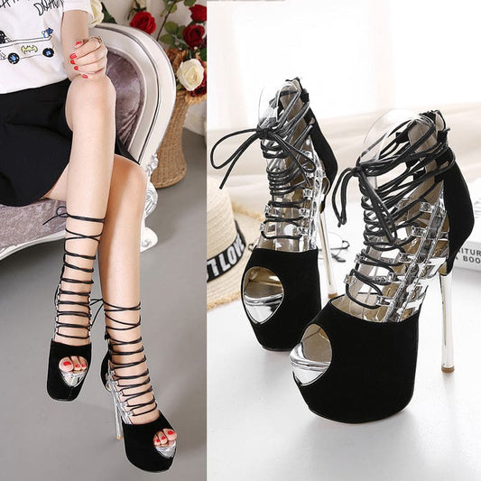 Strappy high-heeled platform sandals with black and metallic elements.