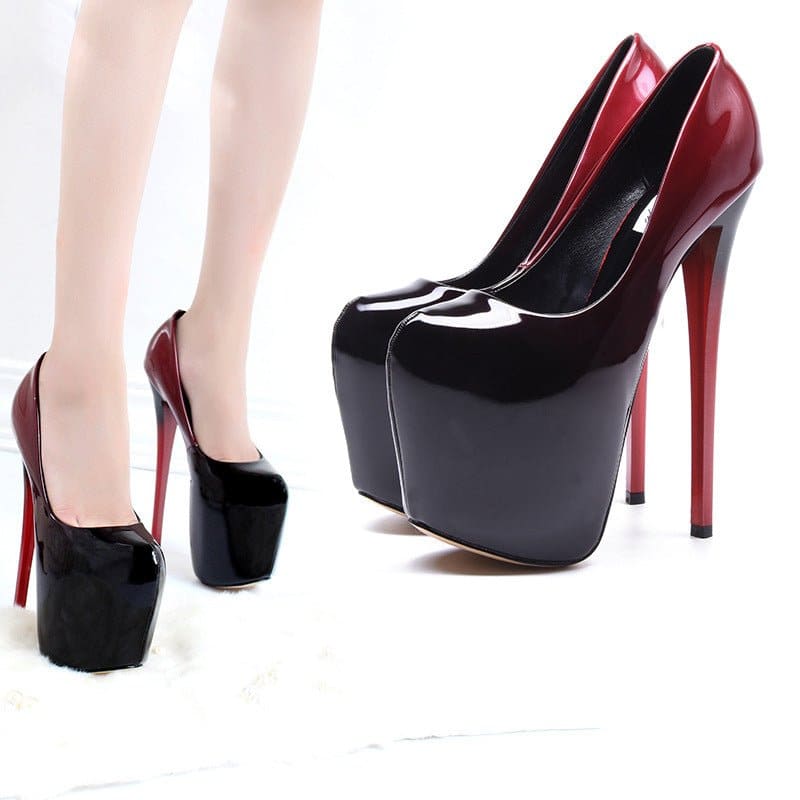 Extremely high-heeled platform stiletto shoes in black and red patent leather.