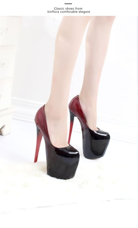 Extremely high platform stiletto heels in burgundy and black.