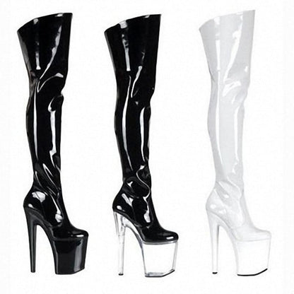 Three pairs of thigh-high platform boots in black and white patent leather.