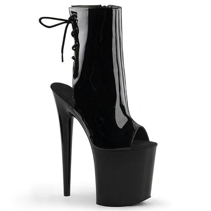 Glossy black high-heeled platform boot with an open toe and lace-up front.