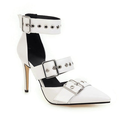 White high-heeled shoe with multiple buckled straps and silver studs.