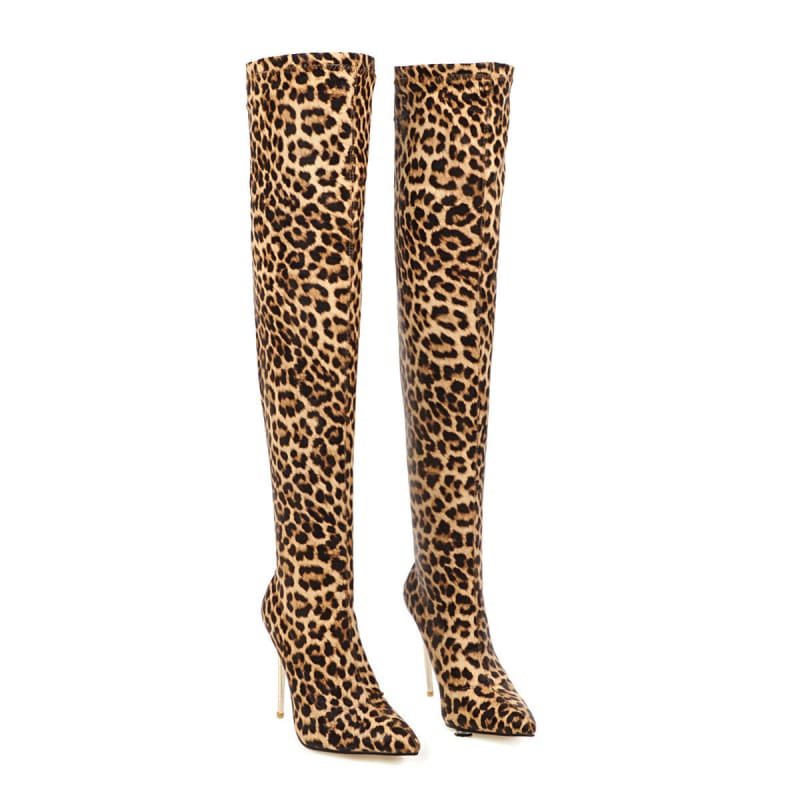 Pair of thigh-high leopard print boots with pointed toes and stiletto heels.