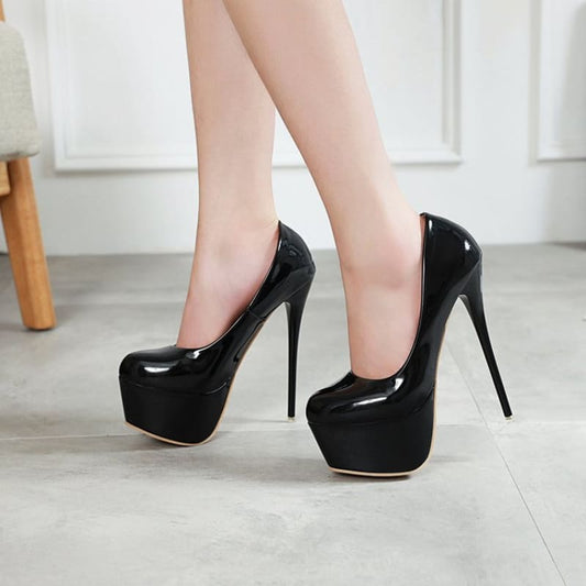 Pair of glossy black platform stiletto high heels.