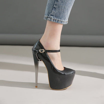 Extremely high-heeled black patent leather platform shoe with an ankle strap.