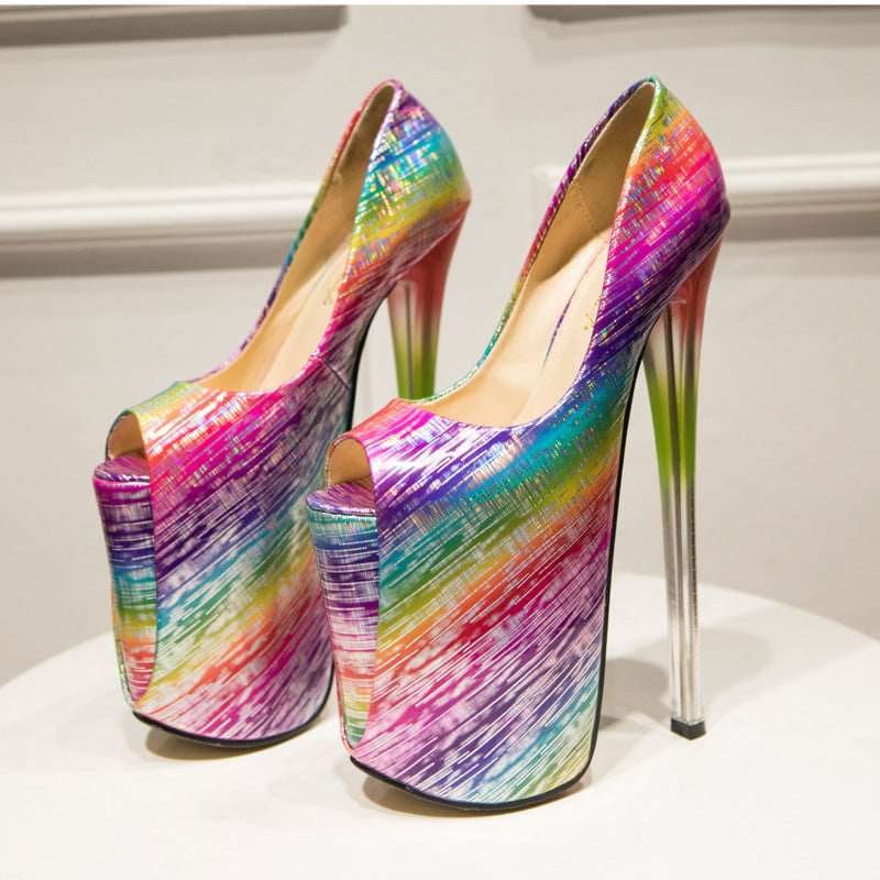 Pair of extremely high platform stiletto heels with a vibrant rainbow-colored pattern.