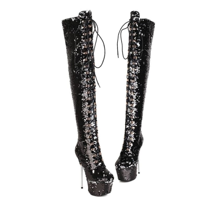 Pair of tall, black sequined platform boots with stiletto heels and lace-up fronts.