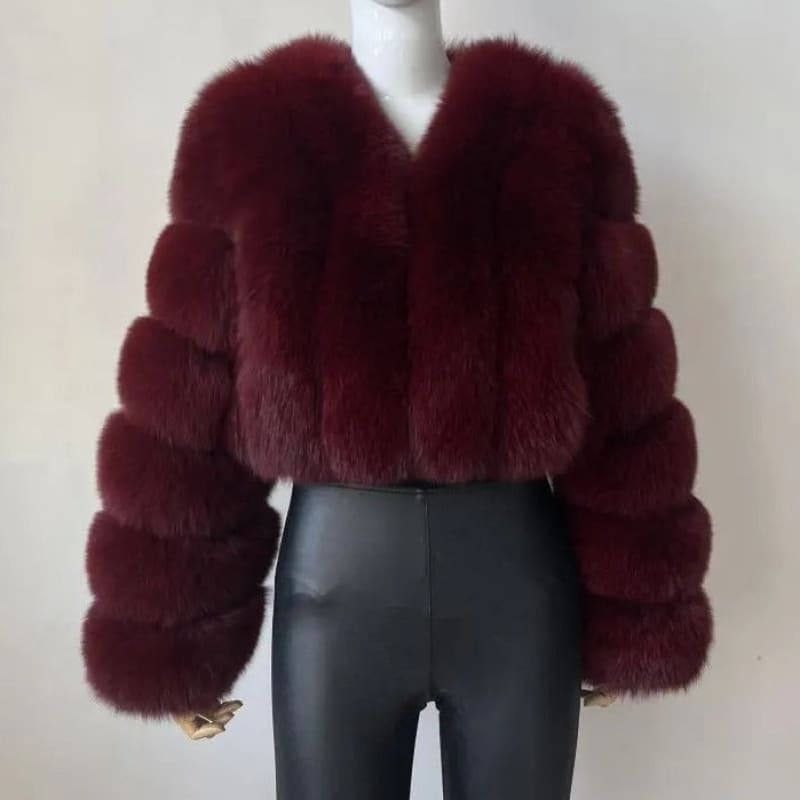 Burgundy faux fur cropped jacket with long sleeves.