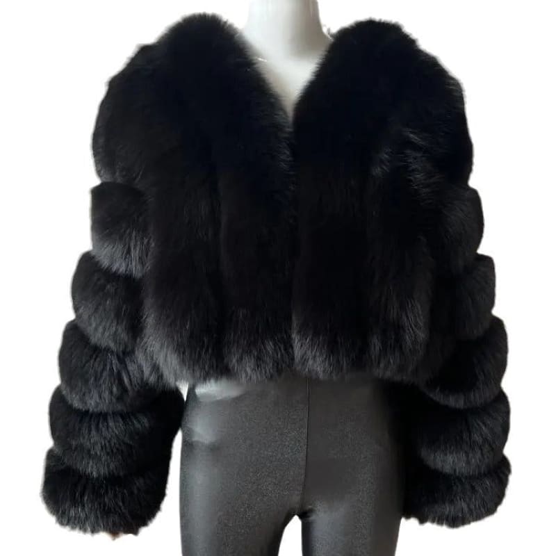 Luxurious black fur coat with thick, fluffy texture and voluminous sleeves.